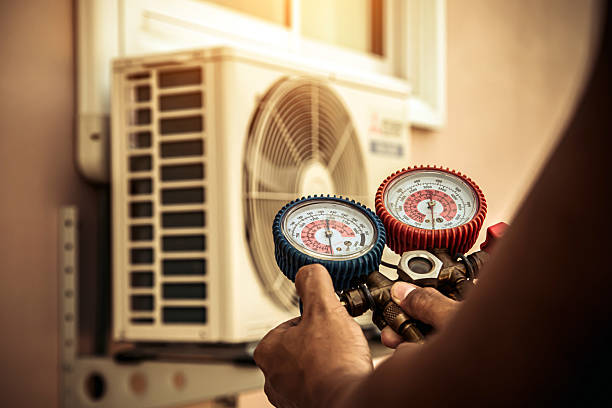Professional Air Conditioning Service technician working in Ballwin, MO